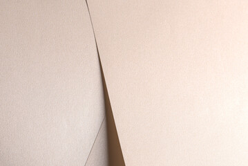 Aufkleber - Champagne beige paper background with a satin, pearlescent texture and softly folded, overlapping triangular layers. Pale gold and muted earthy tones create a warm, elegant, and luxurious abstract.