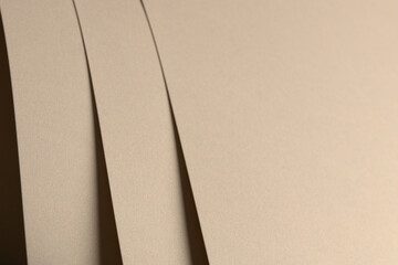 Aufkleber - Paper background with matte texture. Layered smooth sheets in beige, light brown, and golden tones, soft earthy surface, elegant abstract composition, warm muted harmony, refined design..