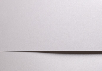Aufkleber - White pearl paper background with a glossy satin texture and softly folded overlapping layers. Icy silver and pale grey hues create a clean, elegant, and luxurious abstract composition with subtle.