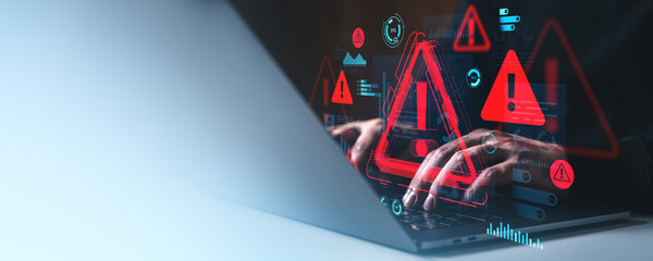 Cybersecurity warning concept with hacker hands on laptop and digital red alert symbols on creative futuristic background interface display.
