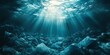© Salman - Sunbeams illuminate plastic waste polluting the ocean floor creating a somber underwater scene. Use this image to raise awareness about marine pollution.