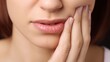 © Jane Kelly - Closeup of person with toothache, holding jaw, Tooth pain
