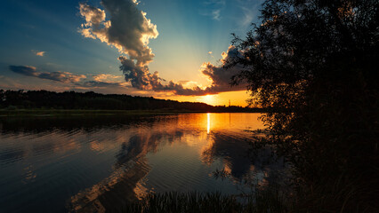Wall Mural - summer sunset over the lake. summer or autumn landscape.