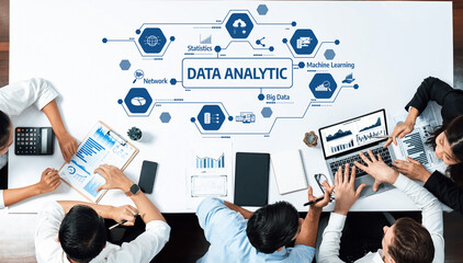 Fototapete - Dynamic workspace showcasing collaboration in data analytics with technology devices and visual data representation. Ideal for business and tech-related themes. Amity
