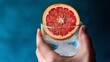 © Dropflare - Fresh grapefruit slice in sparkling water glass – citrus drink close-up