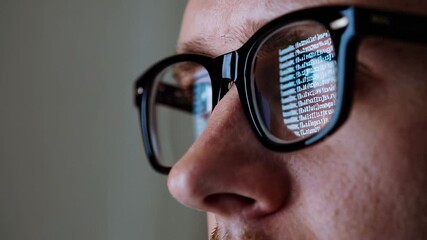 Aufkleber - Software developer intensely focusing on computer screen, code lines reflecting in glasses during deep professional concentration