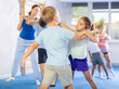 © JackF - Children train in pairs to strike and reflect blows of enemy. Self-defense training and Krav Maga principles