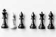 © Anat art - Top-down view of black and white chess pieces arranged on a clean white board showcasing strategic positions during a chess game