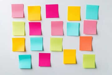Poster - Colorful sticky notes and paper tabs organized on a white desk surface with a neat top-down arrangement promoting productivity