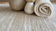 © ArutalaWat - Beige Textured Rug with Rolled Towel and Vase