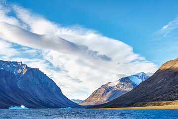 Wall Mural - the icebergs, glaciers and rugged mountains of kjerulf fjord in northeast greenland national park. w