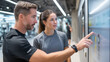 © bytechic - Trainer and Client Using Digital Fitness Interface.