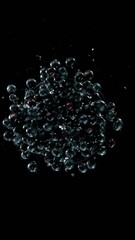 Aufkleber - Super slow motion of rotating blueberries with splashing water, top view. Filmed on high speed cinema camera, 1000 fps. Vertical aspect ratio.