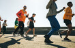 © Jacob Lund - Male runner making finger guns during a community race event