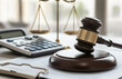 © Mike Stock - Bankruptcy law concept with gavel and calculator on court documents.