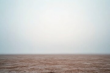 Aufkleber - A vast meadow shrouded in mist showcases a faint glow on the horizon, offering an enchanting atmosphere that invites curiosity and wonder at dawn