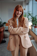 © bernardbodo - Redhead businesswoman posing at work