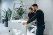 © standret - Two men are standing and working by the 3d printer