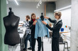 © standret - Clothing production. People are working by the sewing machines indoors