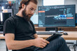© standret - Side view, by computer with 3d printer. Man is in the modern office, one person
