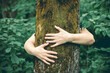 © erika8213 - Nature lover hugging trunk tree - nature loving, fight global warming.