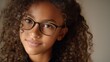 © WS Studio 1985 - Smiling African American Girl with Glasses in Headshot Portrait