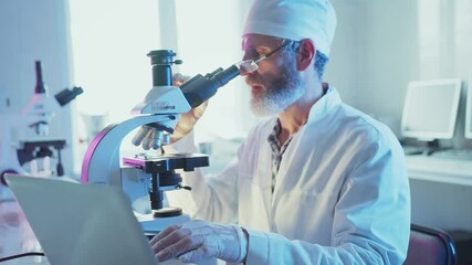 Wall Mural - professional laboratory scientist carefully analyzing biological sample under microscope while docum