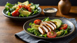 © VujaSaloka - Close-up view of a healthy dish arranged neatly on a wooden table. The plate contains a fresh salad with grilled chicken, avocado, tomatoes, and other fresh ingredients.