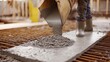 © Allie - Construction worker pouring concrete into formwork. Featuring attention to detail and focus
