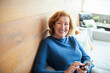 © Geber86 - Senior woman using smartphone for video call or browsing at home