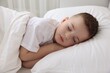 © New Africa - Bedtime. Cute boy sleeping in comfortable bed