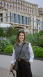 © Krakenimages.com - Woman smiling outdoors in monaco with elegant architecture backdrop conveys luxury and hispanic beauty, featuring young, confident female enjoying the vibrant cityscape.
