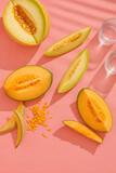 aesthetic top view photo of fresh melon or cantalope isolated on pink background