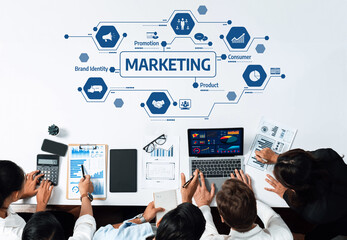 Leinwandbilder - A diverse group of professionals collaborates in a marketing strategy session, utilizing digital devices to analyze data, develop brand identity, and discuss consumer promotion tactics. Amity