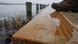 © Anna - Rainy day walk along a wooden pier with water droplets