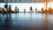 © Suryanto - Blurred People Walking in Airport Terminal with Shiny Tile Floor and Sunlight Through Windows