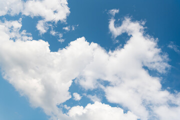 Wall Mural - Clouds at the sky. Cloudscape - Blue sky and white clouds. Beautiful blue sky background with clouds. White fluffy clouds in the blue sky. Blue sky and white clouds of daytime