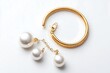 © Biggy - Elegant Gold Hoop Earrings with Pearl Accents on White Background