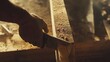 © Allie - A construction worker using a power saw to cut through wood. Featuring skill and precision