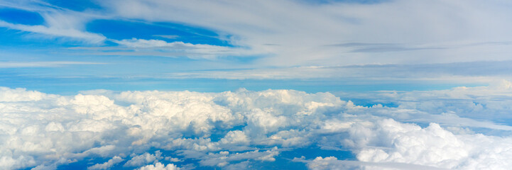 Wall Mural - Aerial cloudscaspe panoramic view of the picturesque clouds and sky from a height in the day over the horizon