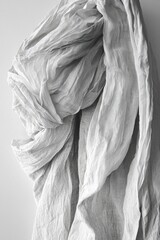 Wall Mural - soft gray fabric draped elegantly on a white background