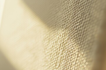 Wall Mural - close-up view of textured surface with soft lighting effects