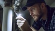 © Soulc - Plumber inspecting a drainage pipe in a basement. Featuring expertise and problem-solving