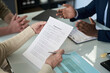 © pressmaster - Close-up of senior couple concluding mortgage agreement with manager in office