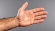 © VISUAL BACKGROUND - A man's hand with his palm up in the air