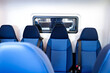 © lina - several blue textured seats in a row inside a vehicle