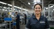 © komori - Woman worker in manufacturing setting with safety glasses smiling