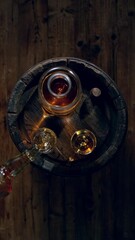 Fototapete - Super Slow Motion of Pouring Whiskey or Rum, Top View Shot. Filmed on High Speed Cinema Camera, 1000 fps. Low Depth of Focus. Vertical Aspect Ratio.