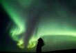 © Muhammad - Woman Silhouette Watching the Northern Lights with Beautiful Aurora Display