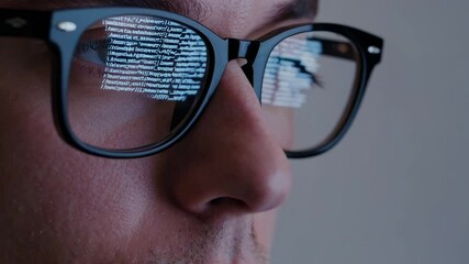 Aufkleber - Programmer wearing glasses reflecting lines of code while deeply focused on developing complex software project in modern office environment